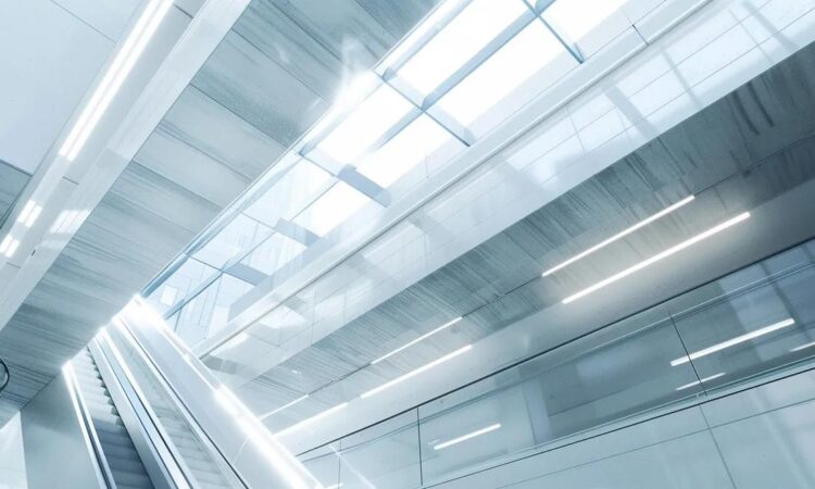 a sleek, modern office environment showcases a series of advanced permanent fall protection systems installed on the ceilings and walls, emphasizing safety and innovation in transportation and public buildings.